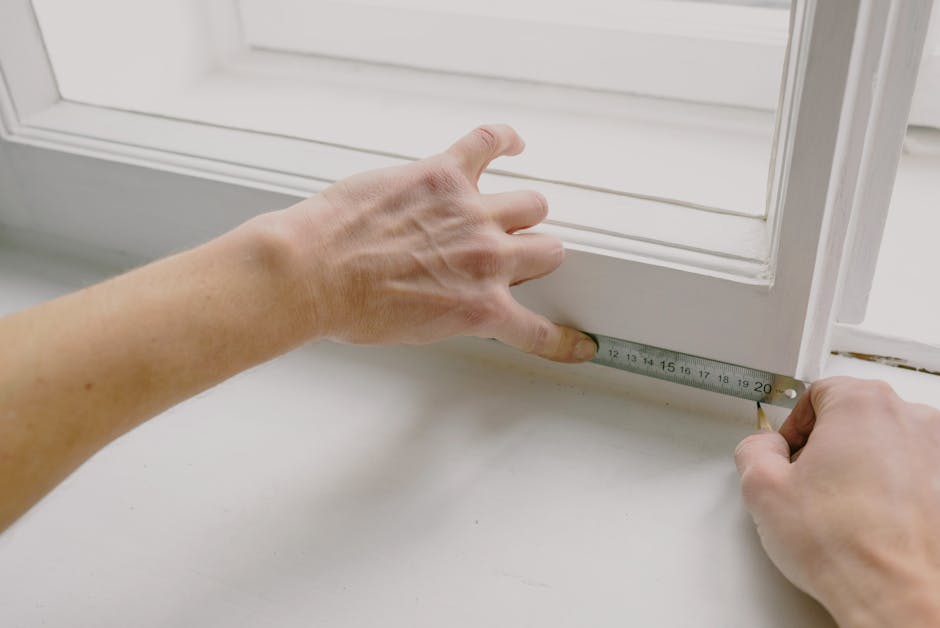 Close-up of a window frame with sealing around the perimeter and gap-check details